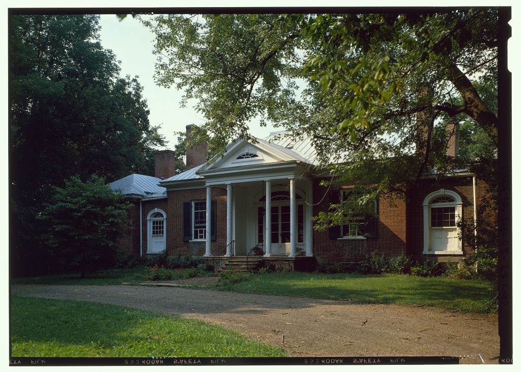 Historic color photograph of Ridgeway’s house seen from the east beneath sunlit trees